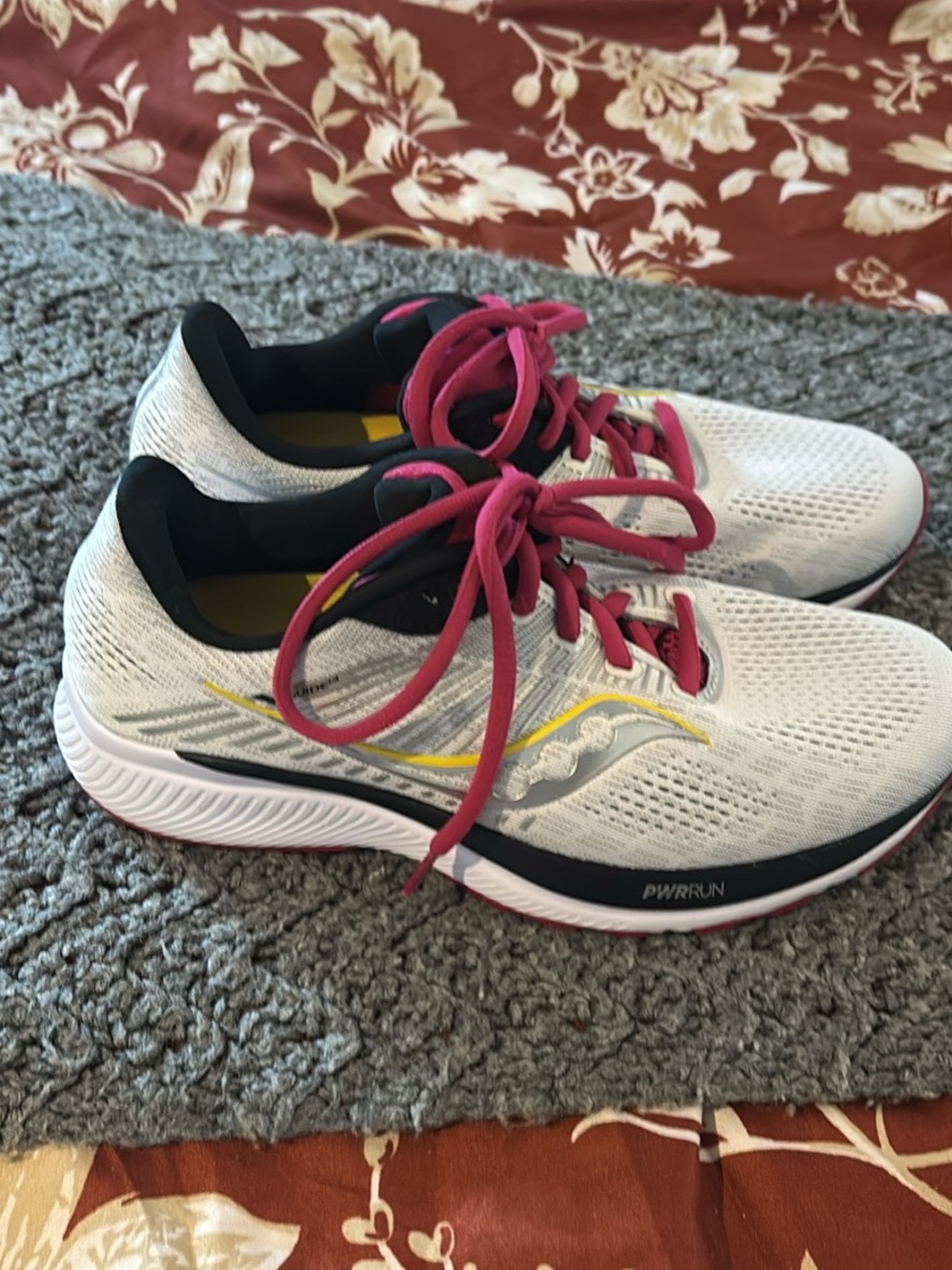 Saucony White Running Shoes with Pink Laces and Yellow Accent